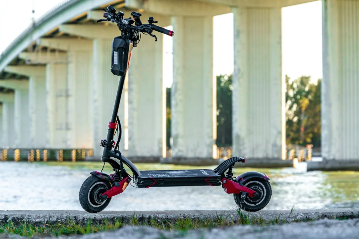 Electric scooter parked by a bridge in San Francisco, showcasing modern urban mobility.