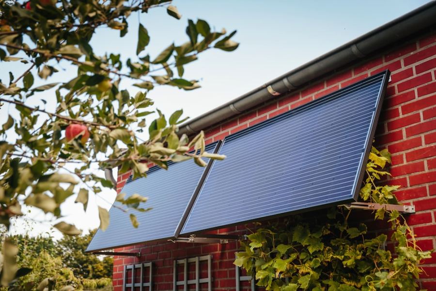 Solar panels mounted flat against a brick wall